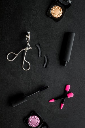 Female desk with decorative organic cosmetic on black background flatlayの写真素材