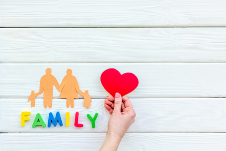 Family copy and figures on wooden table background top view copyspaceの写真素材