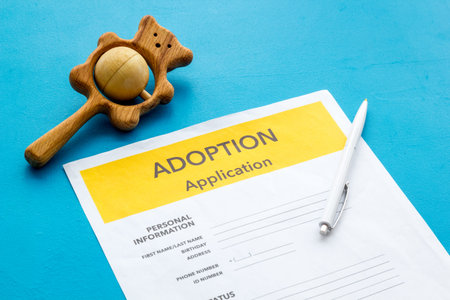 Application to adopt child with toy on blue backgroundの写真素材