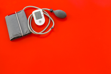 Diagnostics of cardiac disease with pulsimeter on red background top view copyspaceの写真素材