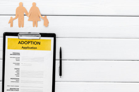 application form for adopt child on white table background top view mock upの写真素材