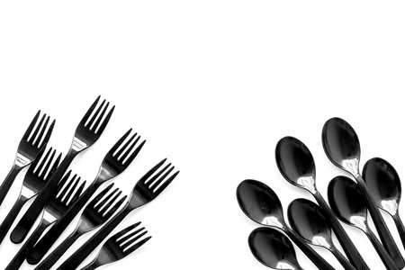 Go green. Plastic flatware for eco and Earth protection concept on white background top view mockup