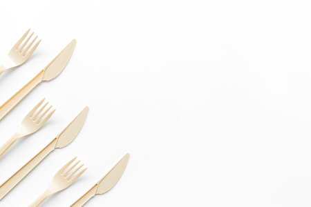 Plastic utilization concept with flatware on white background top view mock up