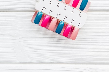 palette for nail artist work on white wooden desk background top view mock upの写真素材
