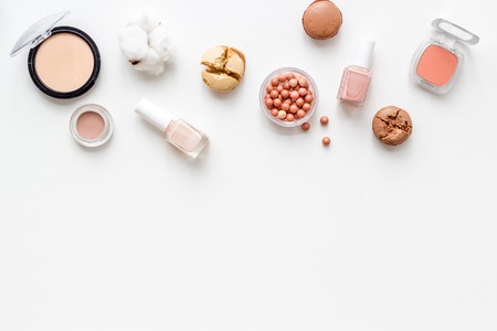 Decorative nude cosmetic set for morning make up on white desk background flat lay copy spaceの写真素材