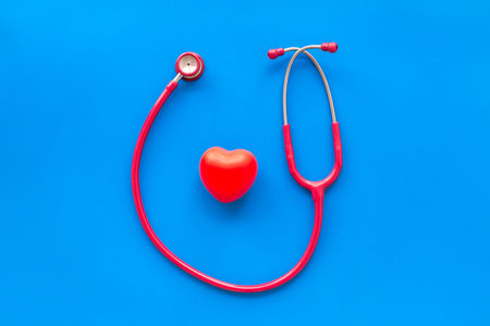 Family doctor. Cardiologist. Diagnostic and cure of cardiac disease with stethoscope and heart on...