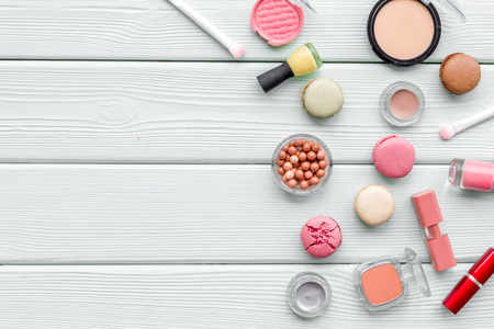Make-up accessories and fashion stylish cosmetics on white wooden desk background top view space for textの写真素材