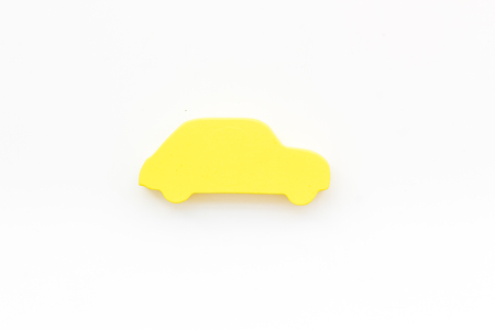 Car insurance concept with car toy on white background top view mockupの写真素材