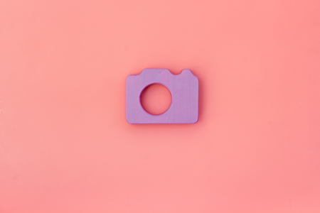 photo camera concept on pink background top view mock upの写真素材