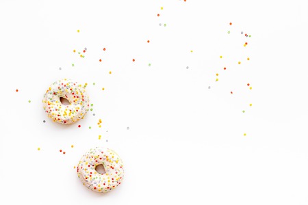 Traditional american donuts of different flavors on white background flat lay mockupの写真素材