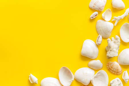 Summer design for blog. Seaside pattern with shells on yellow background top view mock up