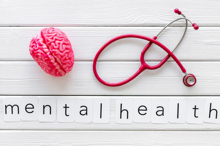 Mental specialist desk. Disease of the brain concept with mental health copy, brain and stethoscope...