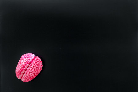 Mental specialist desk. Mental health. Disease of the brain concept with brain on black background...