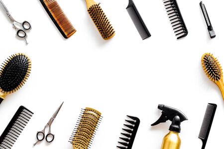 Cut hair. Set of professional hairdresser tools with combs and styling on white background top view frame mock upの写真素材