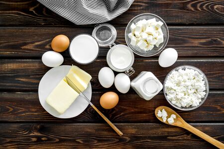 Dairy products. Eggs, butter, milk, yogurt, cottage, cheese for natural farm products yogurt on wooden background top viewの写真素材