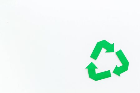 Green recycling symbol for ecology on white background top view mock upの写真素材