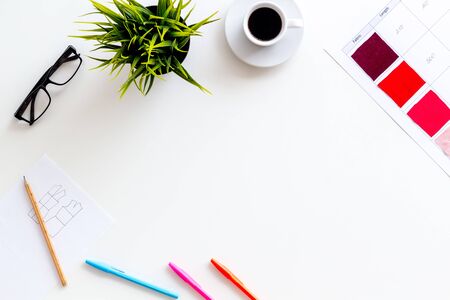 Illustrator instruments. Designer work space with pallet, glasses, plant and cup of coffee on white background top view mockupの写真素材