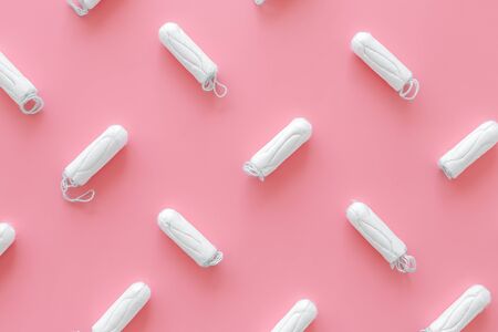 Gynaecologist. Woman hygiene and menstrual period concept with tampons pattern on pink background top viewの写真素材
