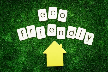 Eco friendly copy and house for ecological concept on green texture background top viewの写真素材