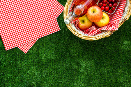 picnic in summer with products, fruits, drinks and hat on white background top view space for textの写真素材