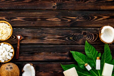 Body treatment with coconut cosmetic on wooden background top view copyspaceの写真素材