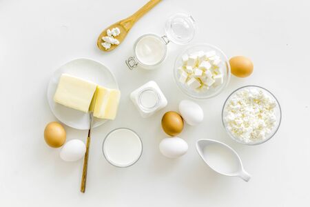 Farm products. Fresh dairy products for breakfast with milk, cottage, eggs, yogurt on white background top viewの写真素材