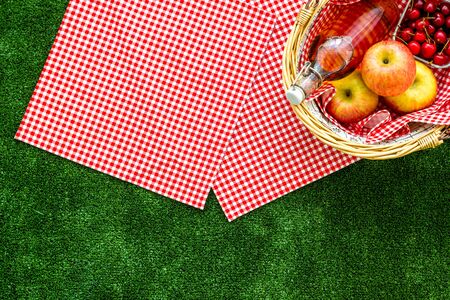 Picnic in summer with products, fruits, drinks and hat on white background top view space for textの写真素材