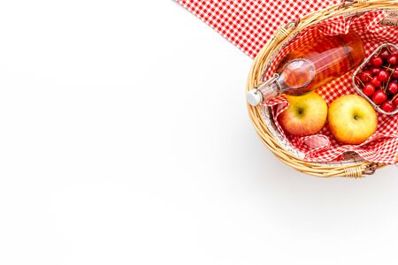picnic in summer with products, fruits, drinks and hat on white background top view space for textの写真素材