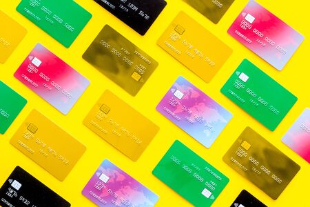 Bank cards pattern on yellow background top view.の写真素材