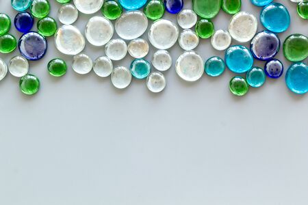 Bright design. Pattern from colored glass stones on gray background top view mockupの写真素材