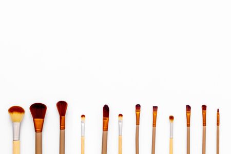 Instruments for make up with brushes on white background top view mock upの写真素材