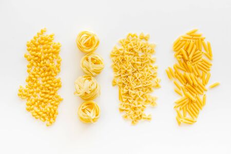 Organic homemade Italian pasta for restaurant on white table background top viewの写真素材
