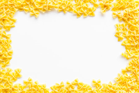 Uncooked pasta frame for Italian food on white table background top view copyspaceの写真素材