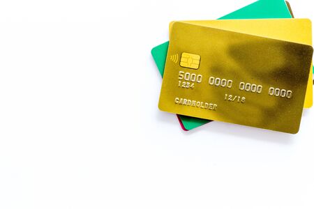 Business with credit cards on office desk white background top view mockupの写真素材