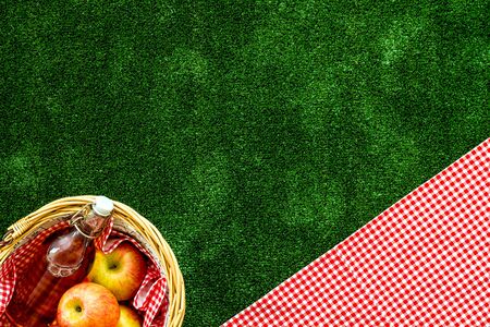 Basket with food. Picnic in summer with products, fruits, drinks and hat on white background top view space for textの写真素材