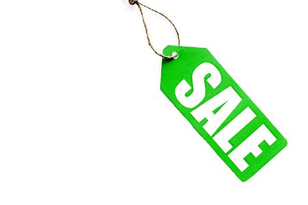 Sale in shop with label on white desk background top view mockupの写真素材