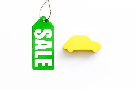 Sale for cars in shop with label and figure on white desk background top viewの写真素材