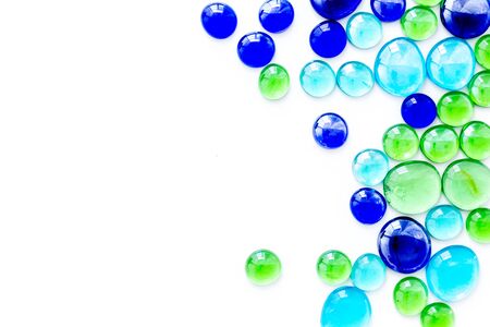 Glass stones for design and home creativity on white background top view space for textの写真素材
