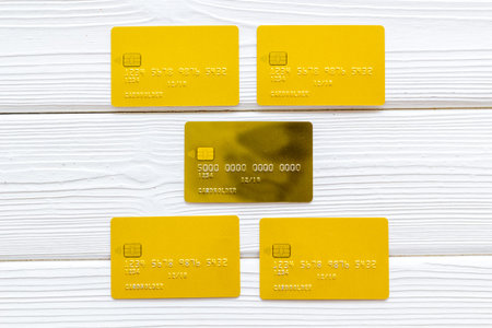 Pay by card in online shop concept on white wooden background top view