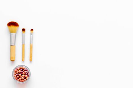 Instruments for make up, blusher. Brushes for make up on white visagiste work desk background top view copyspaceの写真素材