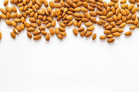 Healthy snack with almonds on white background top view mock upの写真素材
