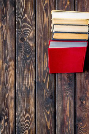 workplace with books on wooden background flatlay mockupの写真素材