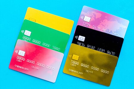 Credit cards for online payment on blue background top viewの写真素材