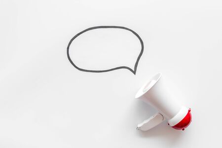Attract attention. Megaphone with bubble for announcement text on white background top view space for textの写真素材