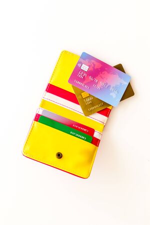 Pay by card in online shop concept and wallet on white background top viewの写真素材