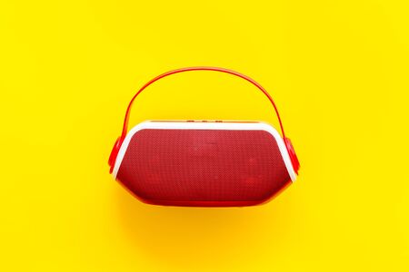 Wireless speaker as music gadgets on yellow background top viewの写真素材