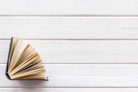 Books on library desk for reading and education on white wooden background top view mock upの写真素材