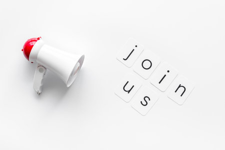 Join us announcement symbol with megaphone and text on white background top viewの写真素材