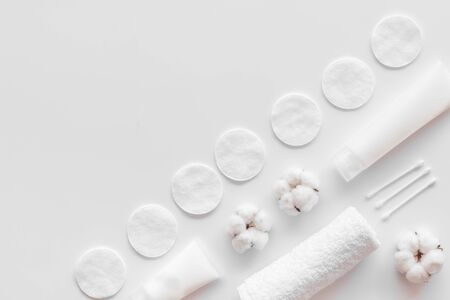 Hygiene cotton swabs, pads and cream for pattern on white background top view mock upの写真素材