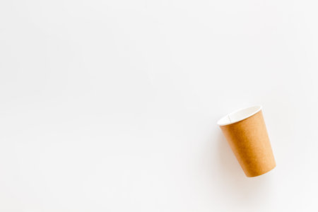 Paper cups for coffee to go on white background top view mockup.